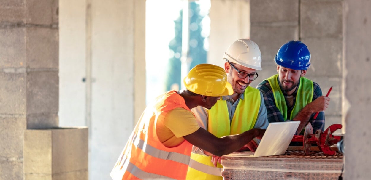 construction workers reviewing plan