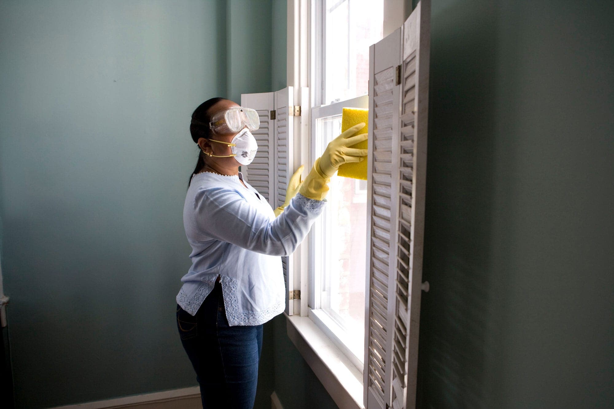 Lady cleaning the window