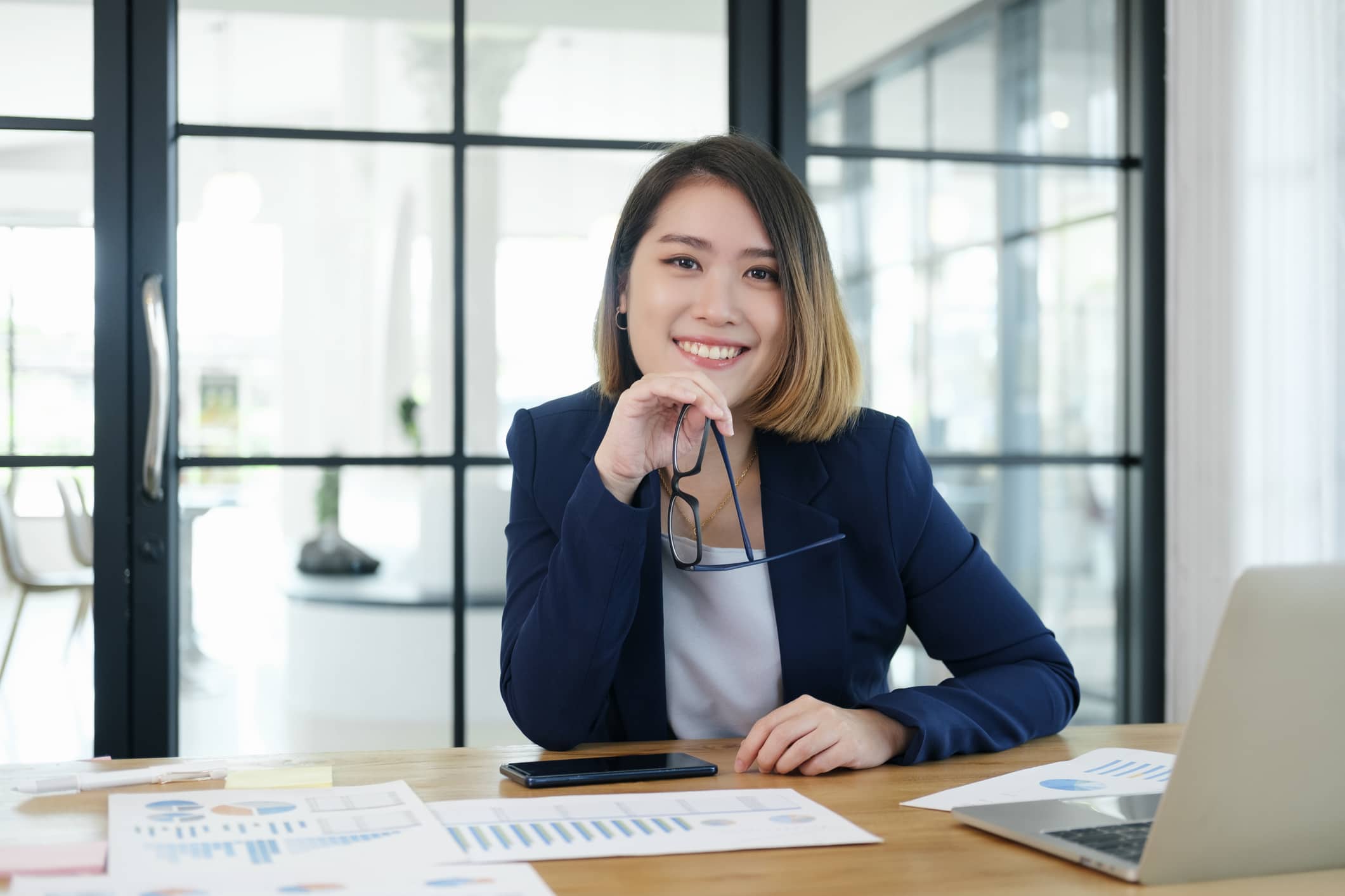 Confident asian businesswoman in office.