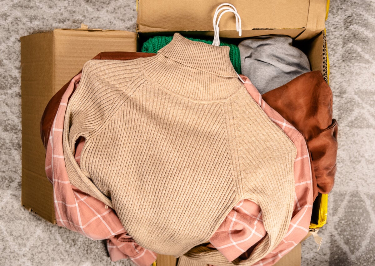 Top view at clothes in cardboard box.