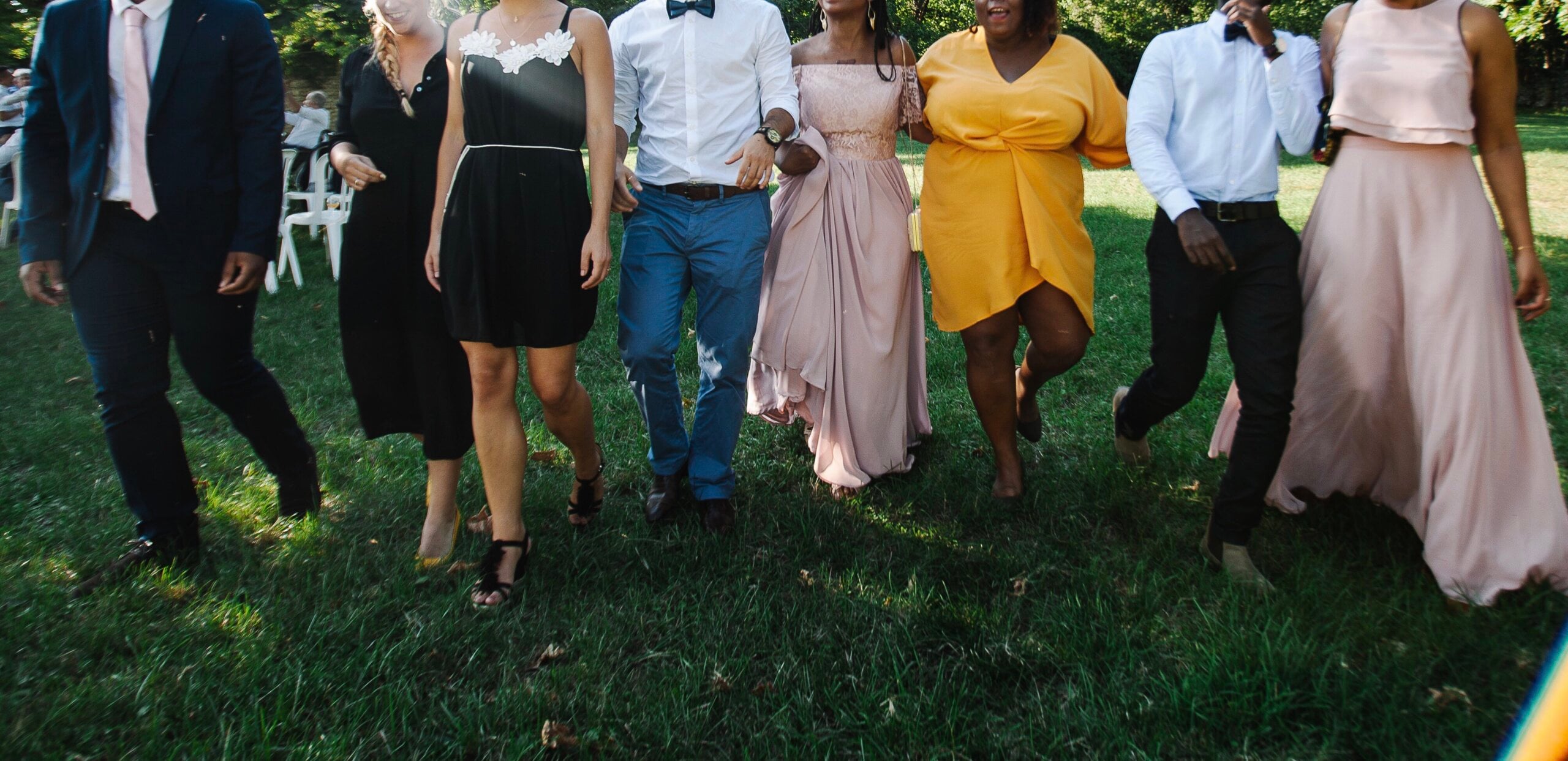 Group celebrating a wedding on a lawn